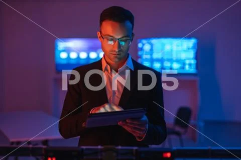 The businessman in glasses working with a tablet Stock Photos