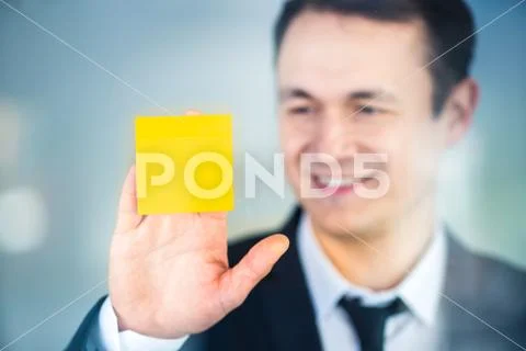 The businessman glue sticker on the window Stock Photos