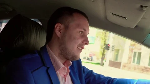 The businessman goes by beautiful expensive car on the downtown Stock Footage