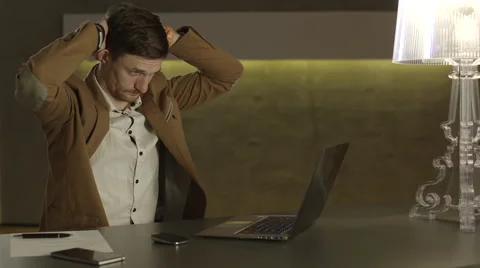 Businessman grasping his head Stock Footage 68545103