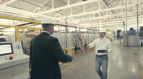 Businessman greeting engineer Stock Footage 65458642