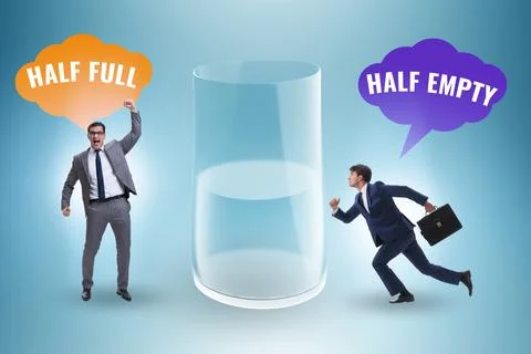 Businessman in half empty half full glass concept Stock Photos