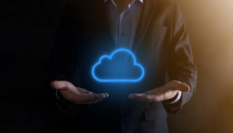 Businessman hand holding cloud computing concept in palm. Backup Storage Data Stock Photos