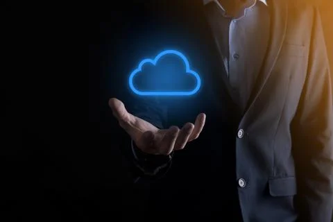 Businessman hand holding cloud computing concept in palm. Backup Storage Data Stock Photos