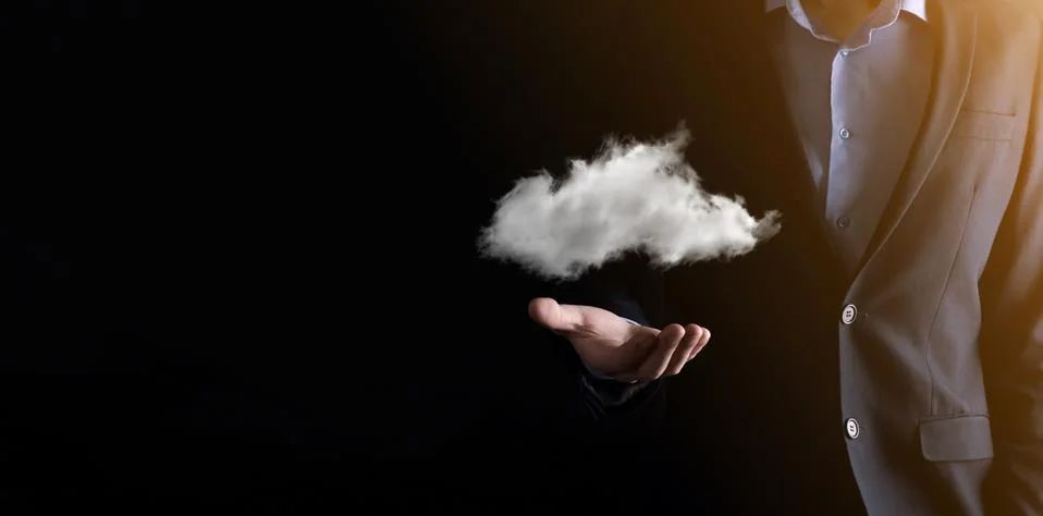 Businessman hand holding cloud.Cloud computing concept, close up of young bus Stock Photos