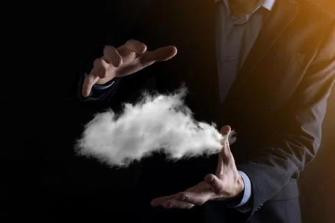 Businessman hand holding cloud.Cloud computing concept, close up of young bus Foto stock