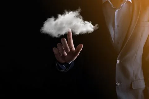 Businessman hand holding cloud.Cloud computing concept, close up of young bus 스톡 사진