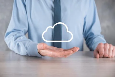 Businessman hand holding cloud.Cloud computing concept, close up of young bus Stock Photos