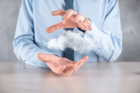Businessman hand holding cloud.Cloud computing concept, close up of young bus Stockfoto's