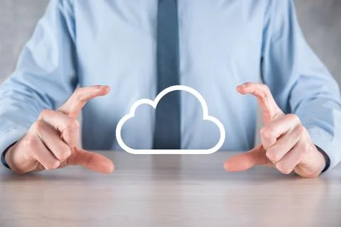 Businessman hand holding cloud.Cloud computing concept, close up of young bus Stock Photos