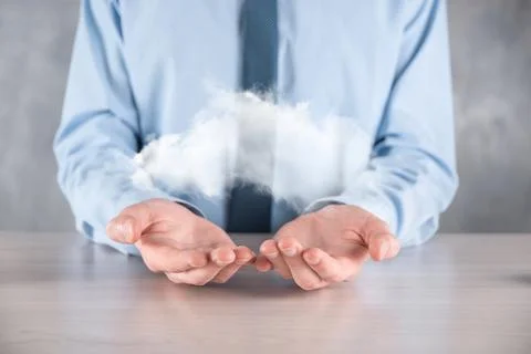 Businessman hand holding cloud.Cloud computing concept, close up of young bus Foto stock