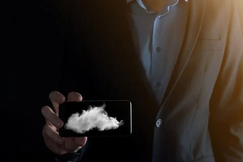 Businessman hand holding cloud.Cloud computing concept, close up of young bus 写真素材