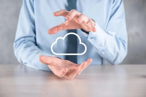 Businessman hand holding cloud.Cloud computing concept, close up of young bus Stock Photos