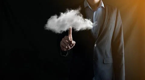 Businessman hand holding cloud.Cloud computing concept, close up of young bus Stock Photos