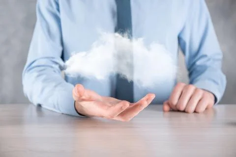 Businessman hand holding cloud.Cloud computing concept, close up of young bus 스톡 사진