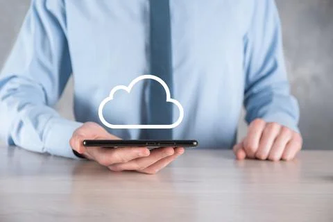 Businessman hand holding cloud.Cloud computing concept, close up of young bus Stock Photos