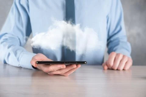Businessman hand holding cloud.Cloud computing concept, close up of young bus Stock Photos