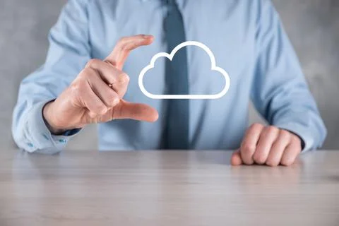 Businessman hand holding cloud.Cloud computing concept, close up of young bus Stock Photos