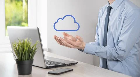 Businessman hand holding cloud.Cloud computing concept, close up of young bus Stock Photos