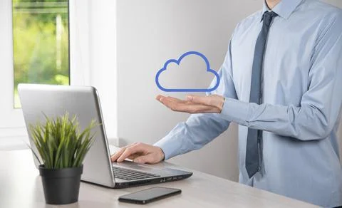Businessman hand holding cloud.Cloud computing concept, close up of young bus Stock Photos
