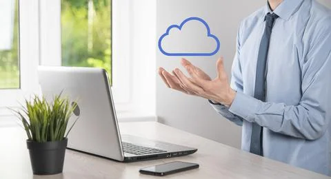 Businessman hand holding cloud.Cloud computing concept, close up of young bus Stock Photos