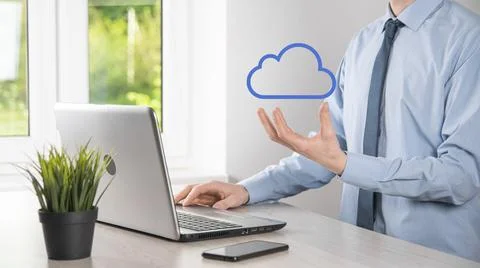 Businessman hand holding cloud.Cloud computing concept, close up of young bus Stock Photos