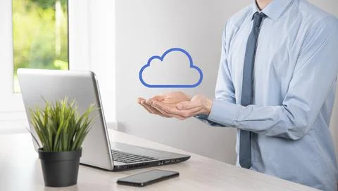 Businessman hand holding cloud.Cloud computing concept, close up of young bus Stock Photos