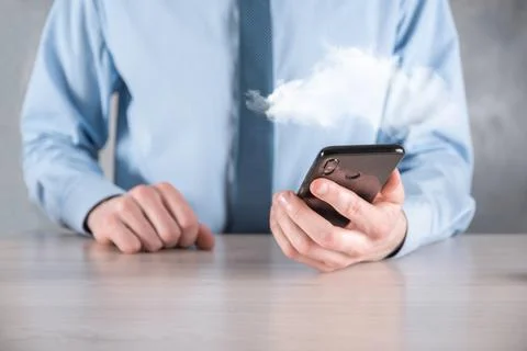 Businessman hand holding cloud.Cloud computing concept, close up of young bus Stock Photos