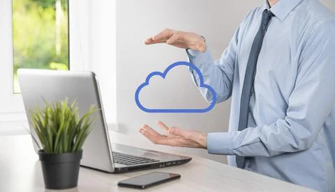 Businessman hand holding cloud.Cloud computing concept, close up of young bus Stock Photos