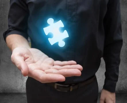 Businessman hand offers solution Stock Photos
