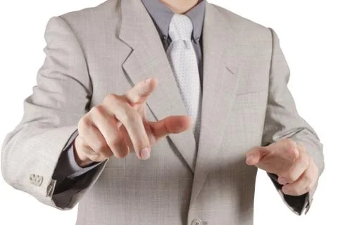 Businessman hand pressing an imaginary button on virtual screen Illustrazione stock
