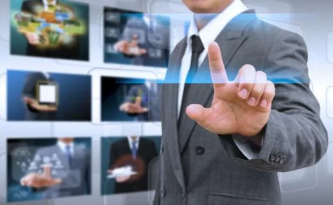 Businessman hand pushing button on a touch screen interface Stock Photos