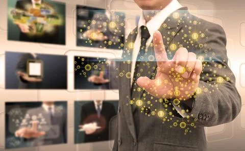 Businessman hand pushing button on a touch screen interface Stock Photos