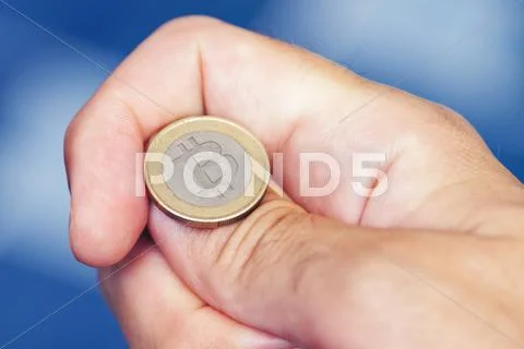 Businessman hand tossing bitcoin Stock Photos