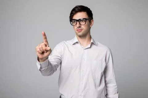 Businessman hand touching empty virtual screen, modern business background co Fotos de archivo