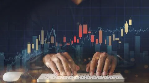 Businessman hand use computer analyze graph for trade stock market on the scr Stock Photos
