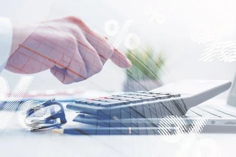 Businessman hand using calculator with virtual infographic overlay of percent Stock Photos