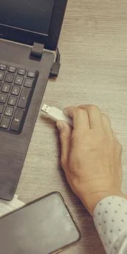 Businessman hand using his usb flash drive, close-up. Office work. Stock-Fotos