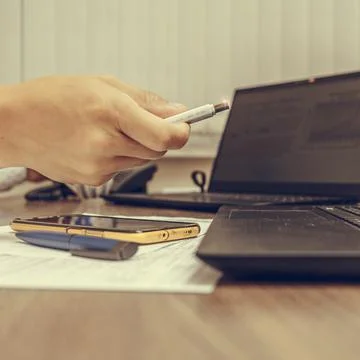 Businessman hand using his usb flash drive, close-up. Office work. Stock Photos