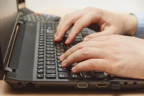 Businessman hand using keyboard on computer laptop Stock Photos