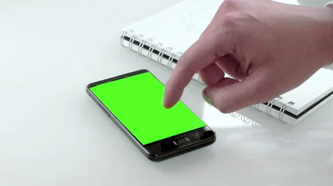 Businessman hand using a smart phone in the office with chroma key, green screen Stock Footage 61360583