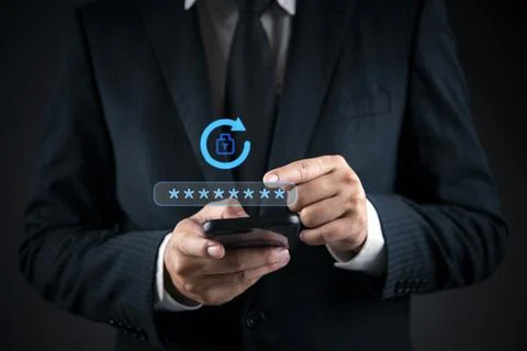 Businessman hand using smartphone with virtual password reset icon. Concept.. Stock Photos