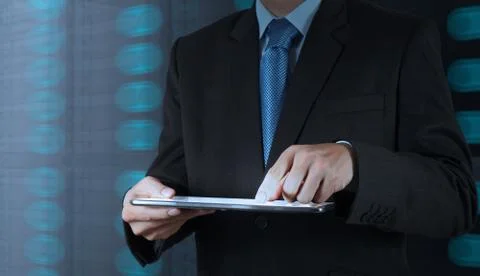 Businessman hand using tablet computer and server room background Stock Illustration