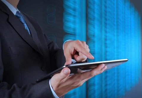 Businessman hand using tablet computer and server room background Stock Illustration