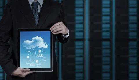 Businessman hand working with a Cloud Computing diagram on the new computer.. Fotos Stock