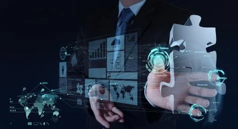 Businessman hand working with computer interface show puzzles Stock-Illustration