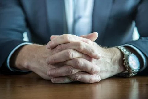 Businessman handa on table Stock Photos
