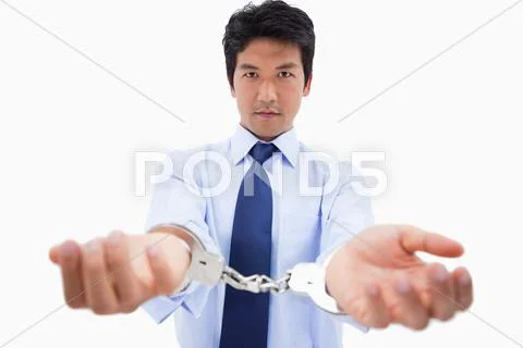 Businessman with handcuffs Stock Photos