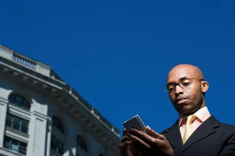 Businessman with handheld computer Stock Photos