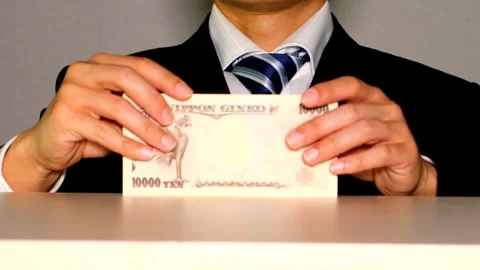 A businessman handing over banknotes Stock Footage 335017002